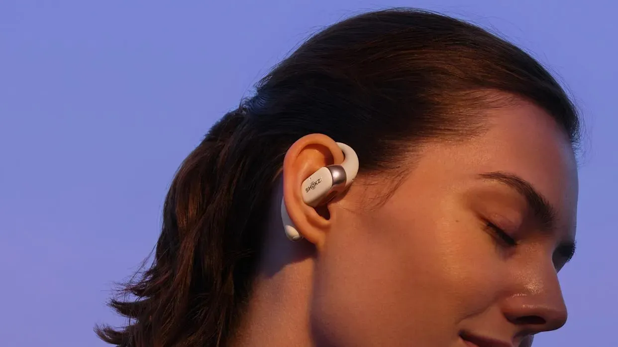 Shokz OpenFit 2 earbuds in charging case showing compact design